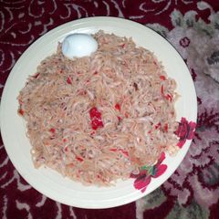 A picture of Jollof Spaghetti and macaroni with egg.