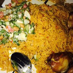 A picture of Jellop rice and beans with salad.