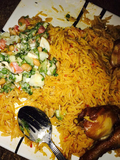 A picture of Jellop rice and beans with salad.