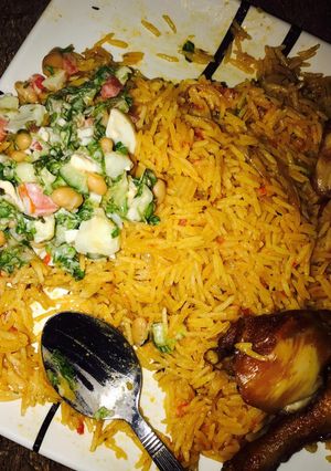 A picture of Jellop rice and beans with salad.