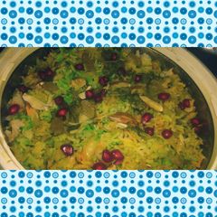A picture of Tricolor mix veg briyani with cheese and anar seeds.
