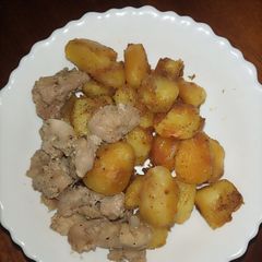 A picture of Oven Raosted Potatoes Served with Pork.