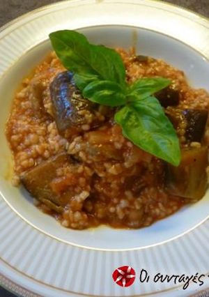 A picture of Trahana with eggplants in the tava.