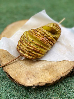 Una foto de Guarnición: Patatas hasselback con especias Joyful Coast