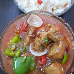 A picture of Chicken shashlik with fried rice.