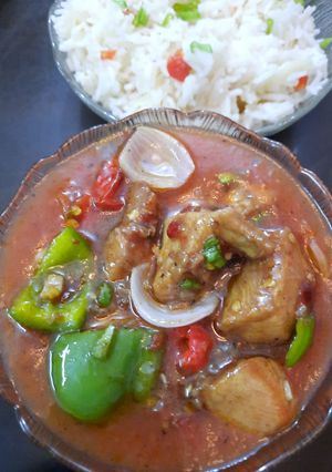 A picture of Chicken shashlik with fried rice.