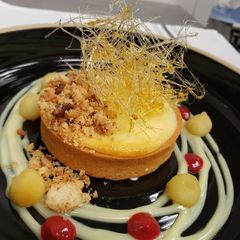 A picture of Chickpea Tart Banana & Cream Cheese Mousse with Peanut Crumble.