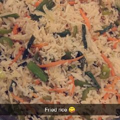 A picture of Chicken jalfrezi with fried rice.