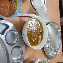 A picture of Rice, dal, cauliflower fry,garlic rasam.