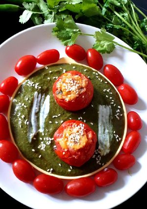 A picture of Baked Stuffed Tomato in Creamy Spinach.