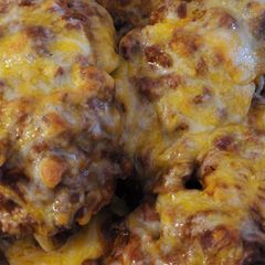 A picture of Chili cheese hassleback potatoes.