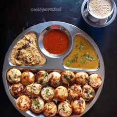A picture of Vegetable appe with red chilli coconut chutney.