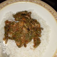 A picture of White rice with Vegetables sauce.