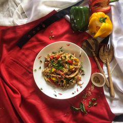 A picture of Barbeque chicken salad in tahini sauce.