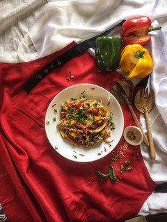 A picture of Barbeque chicken salad in tahini sauce.