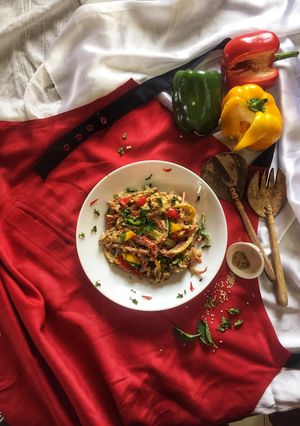 A picture of Barbeque chicken salad in tahini sauce.