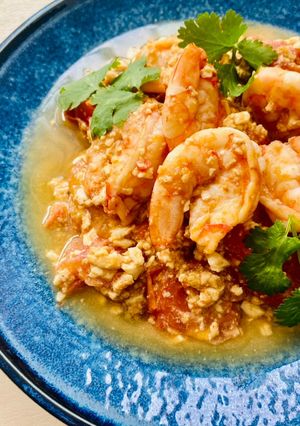 A picture of Tomato Prawns with tofu egg stir-fry.
