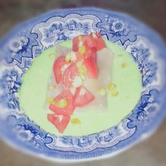 A picture of Shredded chicken Ravioli with Coriander and yogurt Chutney.
