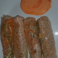 A picture of Crispy summer rolls with siracha mayo.