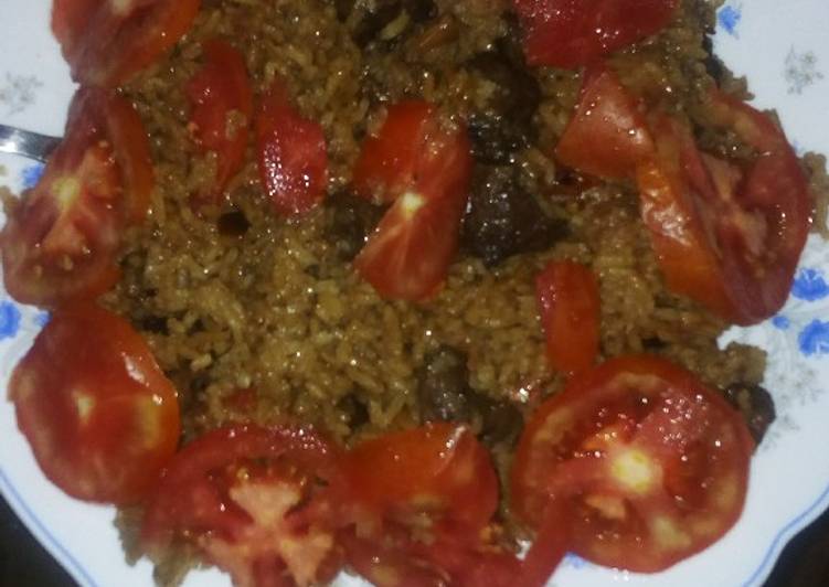 Steps to Prepare Perfect Beef pilau garnished with tomatoes