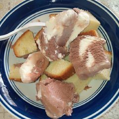 A picture of Cake left over with ice cream.