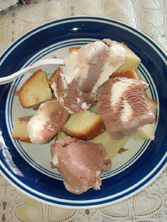 A picture of Cake left over with ice cream.