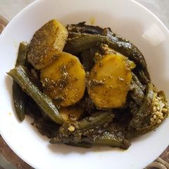 A picture of Fried bhindi potatoes sabzi.