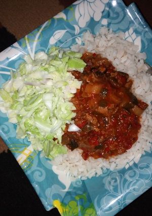 A picture of Rice nd stew with coslow.