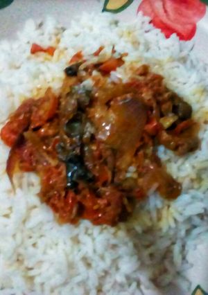 A picture of White rice and Fish Gravy.