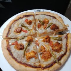 A picture of Tikka Pizza (without cheese+without yeast).