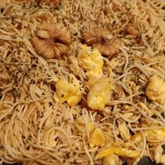 A picture of Walnut eggnuts soy source herby fried noodle.