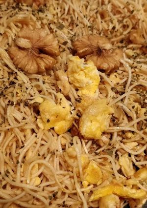 A picture of Walnut eggnuts soy source herby fried noodle.