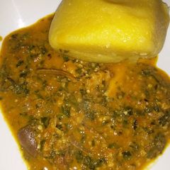 A picture of Eba wit ugu and waterleaf soup.
