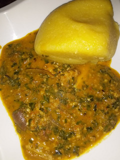 A picture of Eba wit ugu and waterleaf soup.