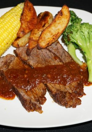 A picture of Beef Brisket with Homemade Barbecue Sauce.