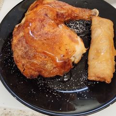 A picture of Chicken leg with plum sauce & spring roll. Airfyer.