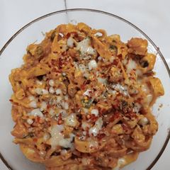 A picture of Chicken fettuccine creamy pink pasta.