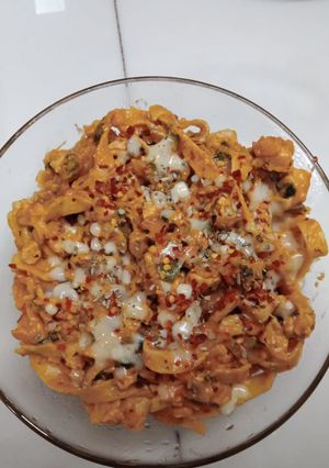 A picture of Chicken fettuccine creamy pink pasta.