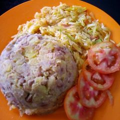 A picture of Kimanga served with cabbage.