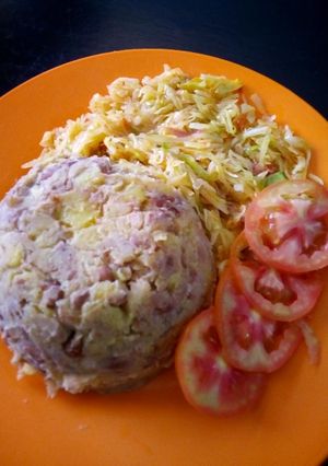 A picture of Kimanga served with cabbage.