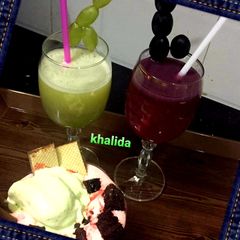A picture of Green and black grape juices.