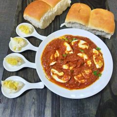 A picture of Tomato egg curry.