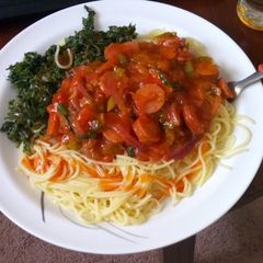 A picture of Spaghetti, spinach and sausage stew.