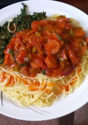 A picture of Spaghetti, spinach and sausage stew.