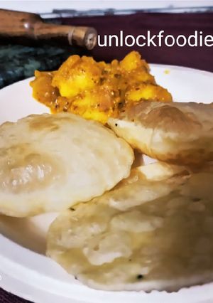 A picture of Luchi and Aloo Dum.