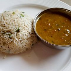 A picture of Yellow Dal served with peas pulao.