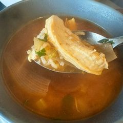 A picture of Lebanese rice and chicken red soup.
