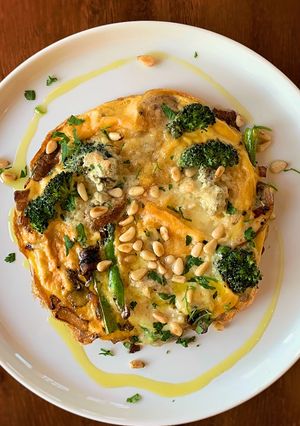 A picture of Omelette, mushroom, broccoli & soft Gorgonzola.