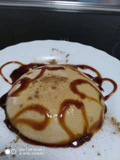 Una foto de Panacotta de dulce de leche con canela