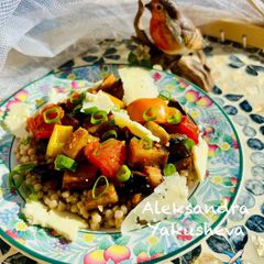A picture of Warm aubergine salad with giantwholewheat couscous and smoked cheese.